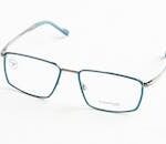 Modern Titanflex eyeglasses with clear lenses and elegant metal frames, styled for a minimalist studio shoot.